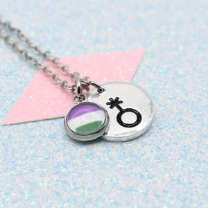 Necklace with a pride flag charm and gender queer pride symbol on a light blue background