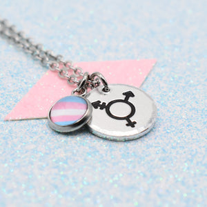 Transgender Pride Necklace with two charms including transgender pride flag on a light blue background