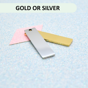Two metal bars, one silver and one gold, on a light blue textured background with 'GOLD OR SILVER' text above.