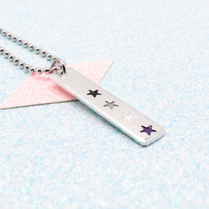 LGBTQ+ asexual Necklace bar pendant featuring colourful star designs representing the asexual pride flag on a light blue background on a Ball Chain