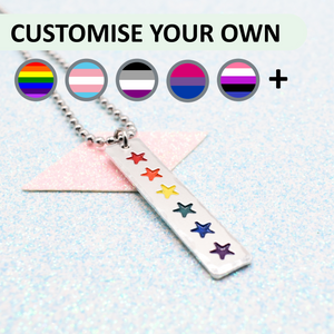 Customisable necklace with lgbtq pride rainbow-colored star charms on a light blue background.