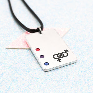 Bisexual Necklace with a rectangular tag featuring a Bisexual symbol and accents on a leather cord displayed on a light blue background