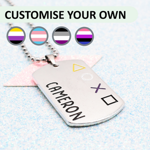 Personalized dog tag with 'Cameron' engraved, featuring gender pride flag designs on a light blue background.