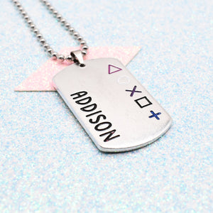 Gender Fluid pride coloured Dog tag necklace with personalised name and gaming symbols on a light blue background - On a ball chain