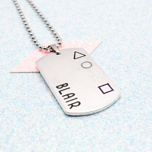Asexual Dog tag necklace with 'personalisation' engraved on a light blue textured background