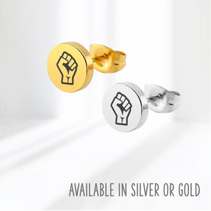 Pair of earring studs in silver and gold with Resist Fist Logo on blue background