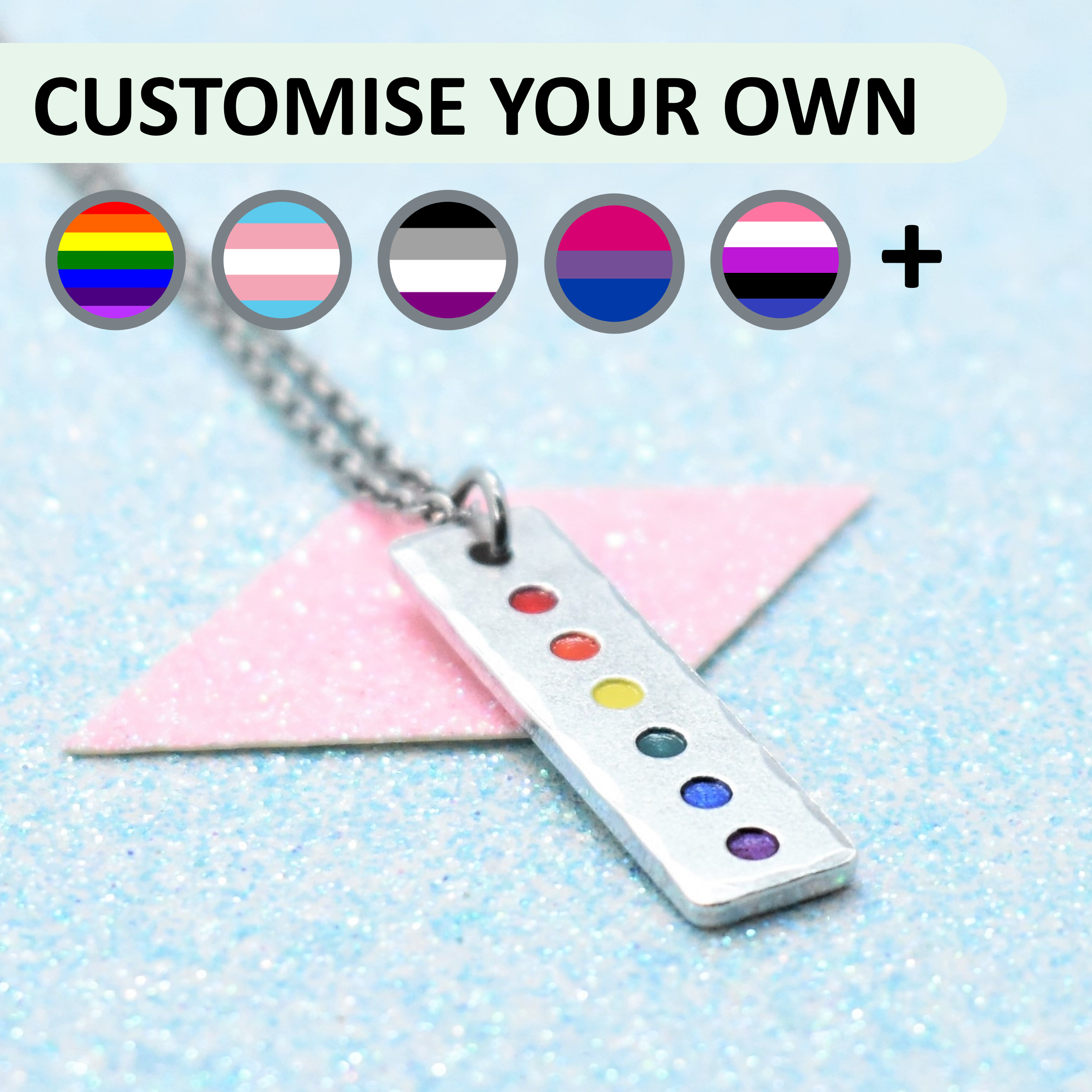 Pride pendant necklace with a chain on a light blue background, featuring customisable options.