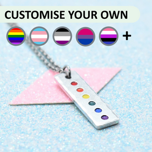 Pride pendant necklace with a chain on a light blue background, featuring customisable options.
