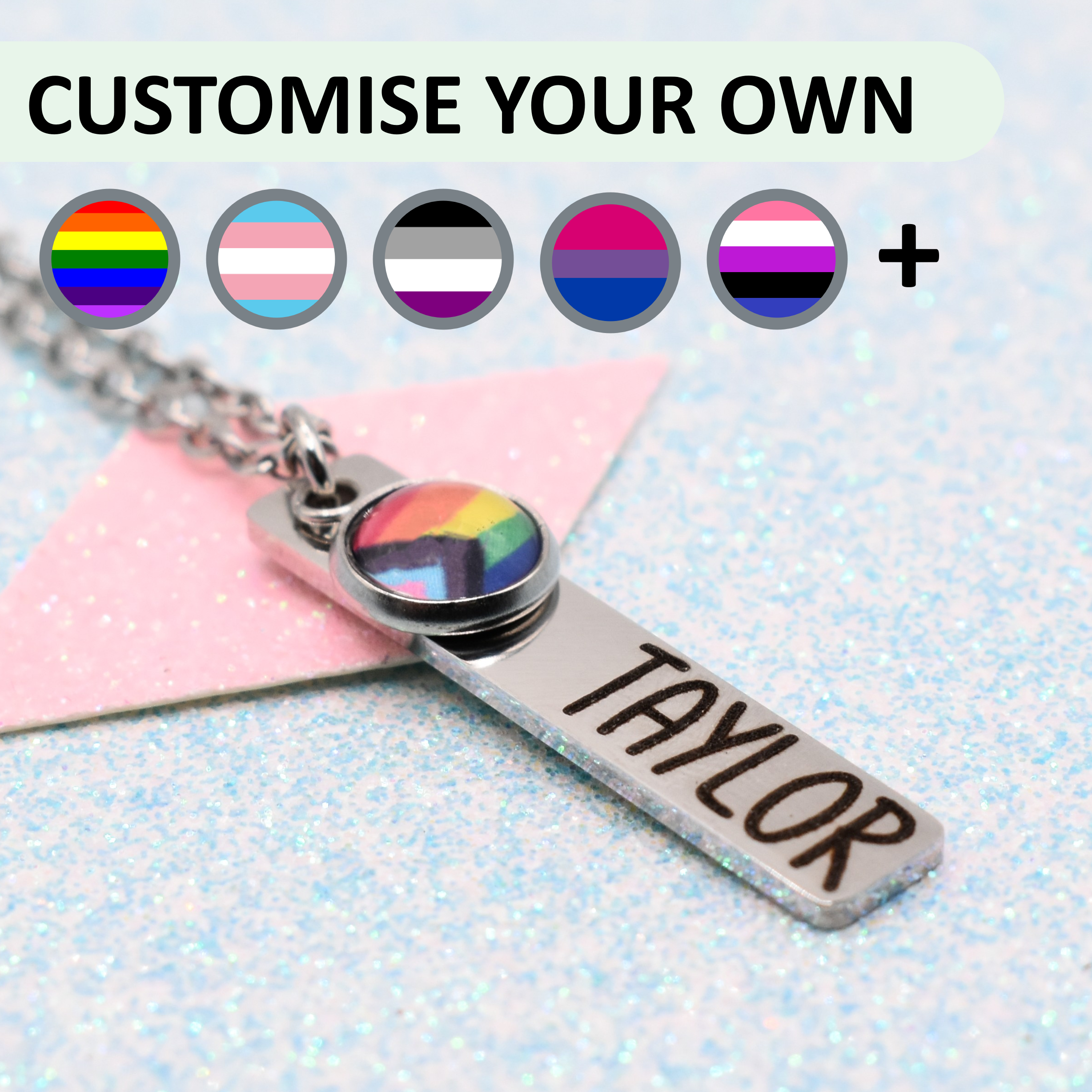 Personalized necklace with customizable nameplate and rainbow flag design on a glittery background.