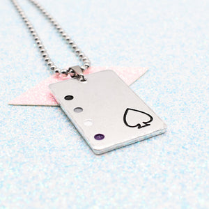 Asexual Necklace with a rectangular tag featuring a Asexual symbol and accents on a ball chain displayed on a light blue background